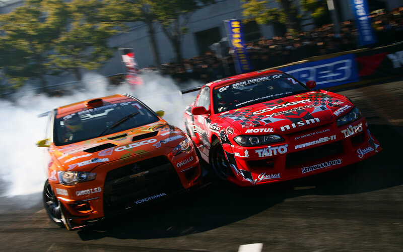 Two cars drifting in a race