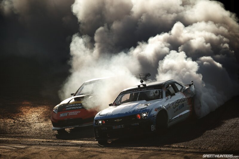 Two cars drifting in smoke