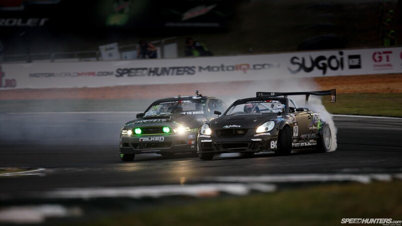 Two cars drifting on a track