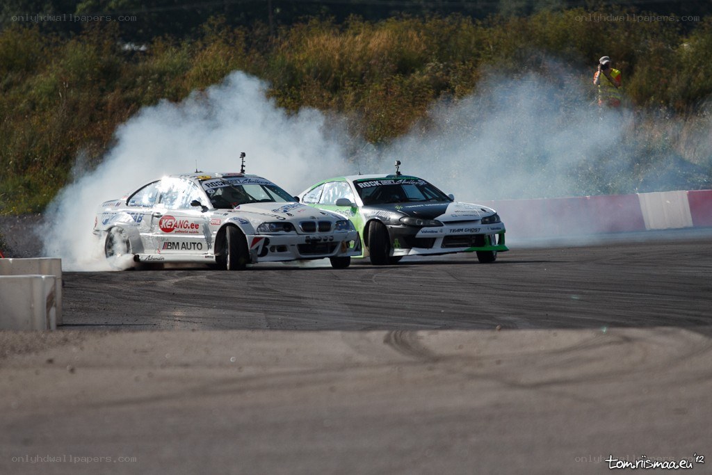 Two cars drifting on a track