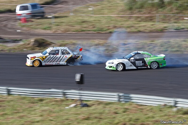 Two cars drifting on a track