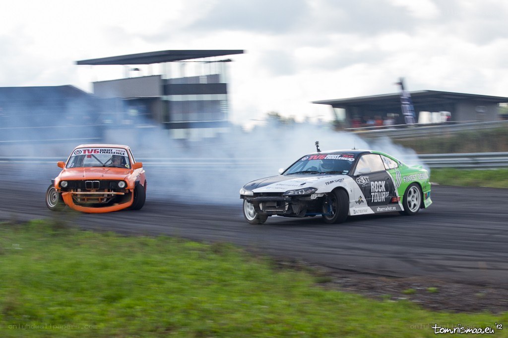 Two cars drifting on a track