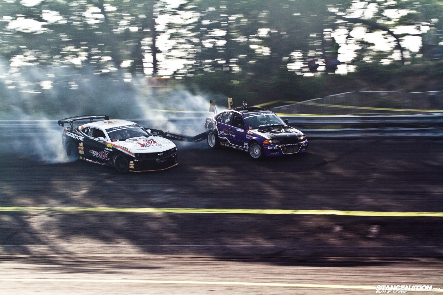 Two cars drifting on a track