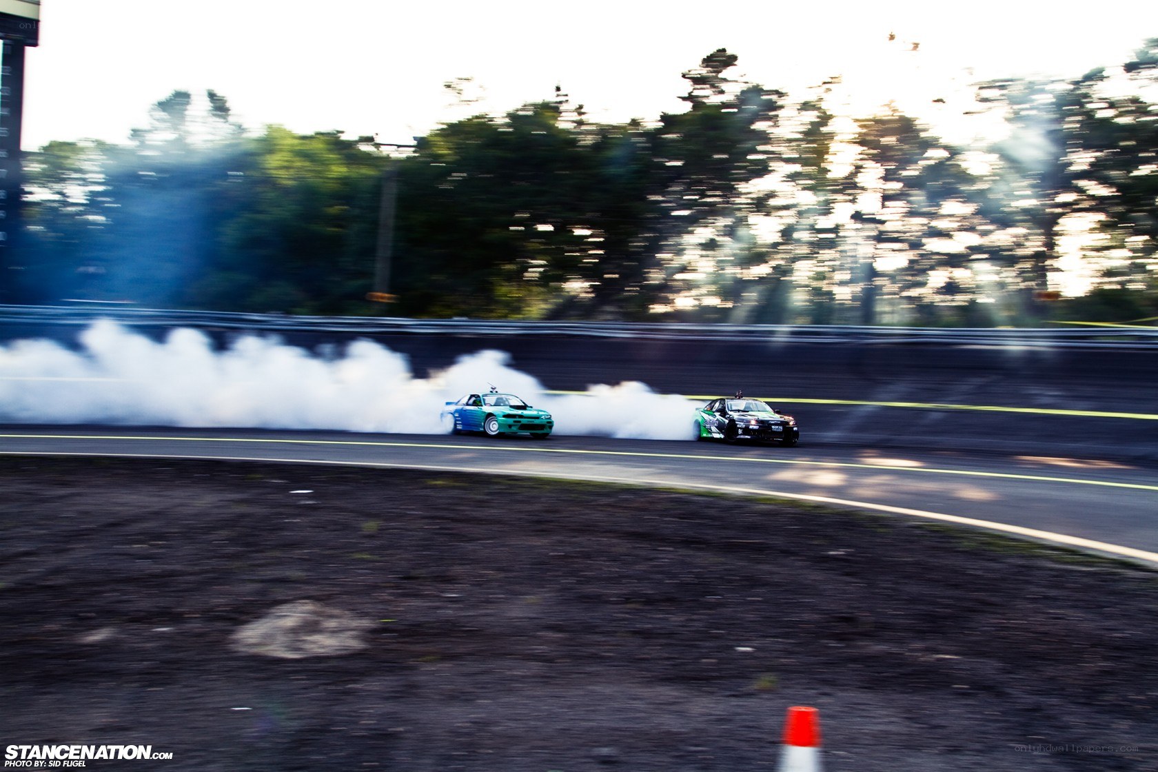 Two cars drifting on a track