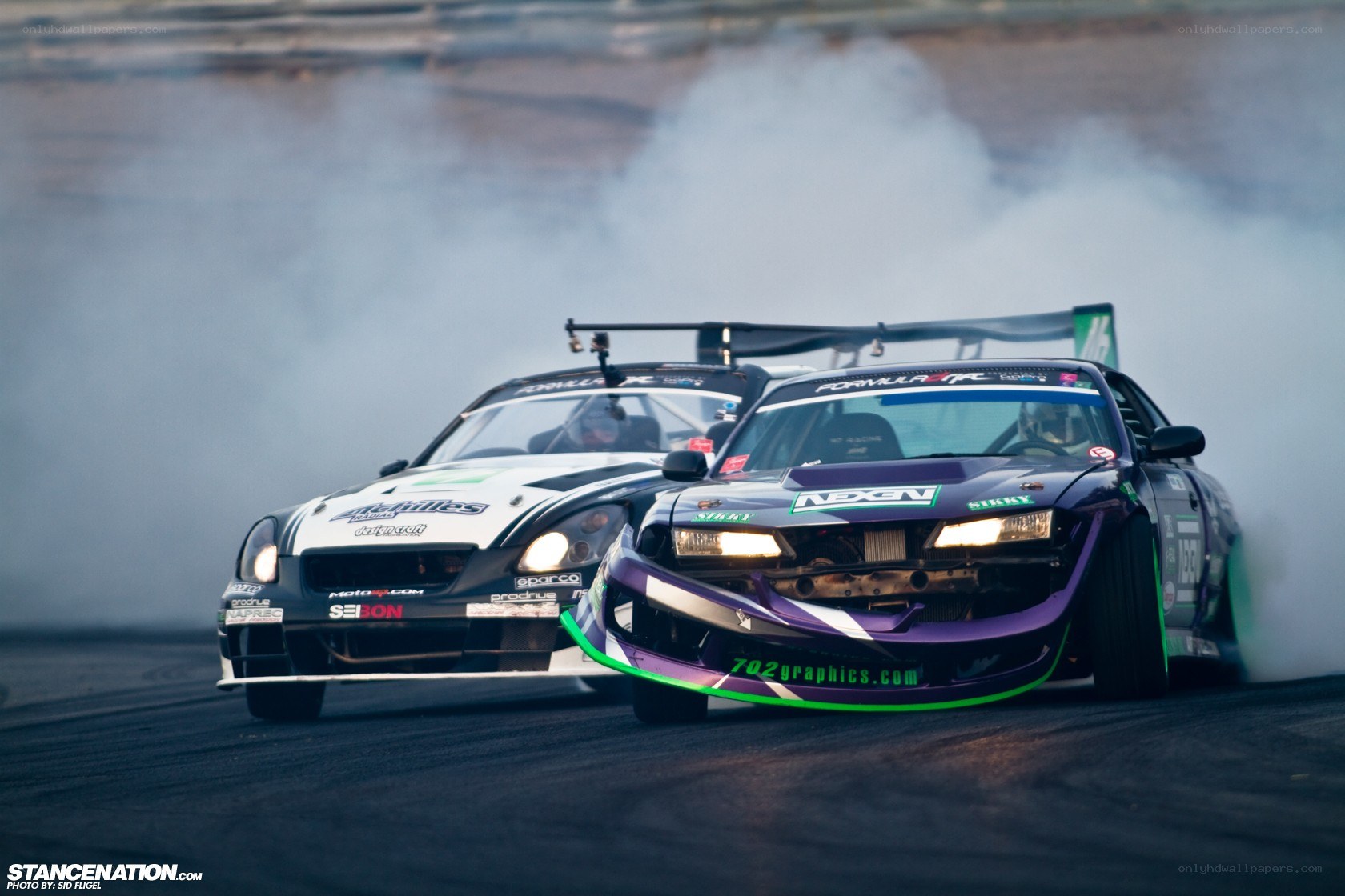 Two cars drifting on a track
