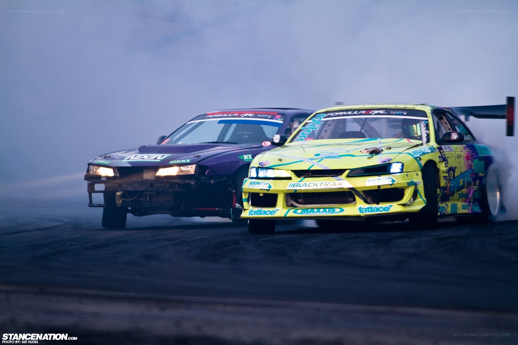 Two cars drifting on a track