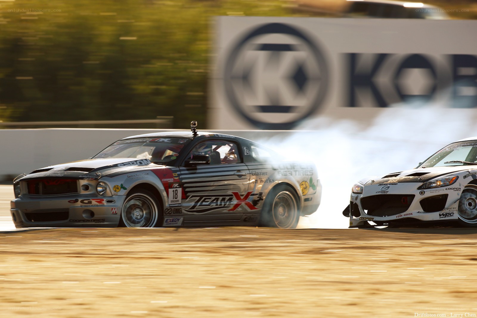 Two cars drifting on a track