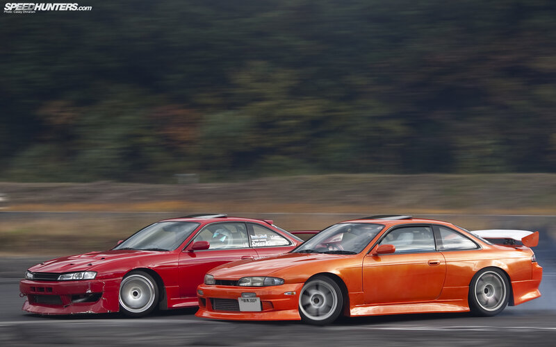Two cars drifting on a track