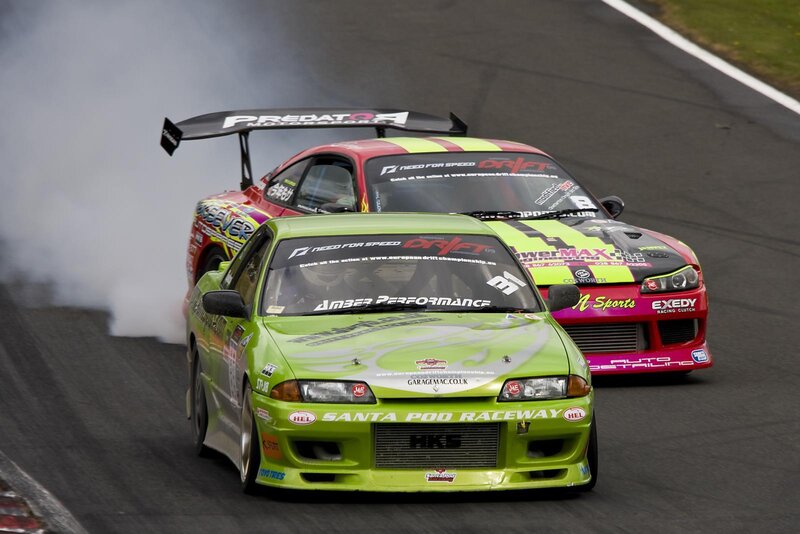 Two cars drifting on a track