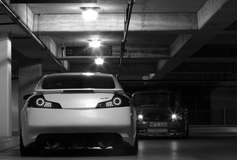 Two cars in a parking garage