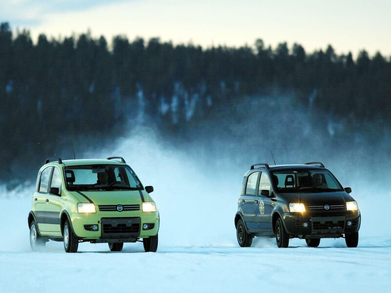 Two cars on a snowy field