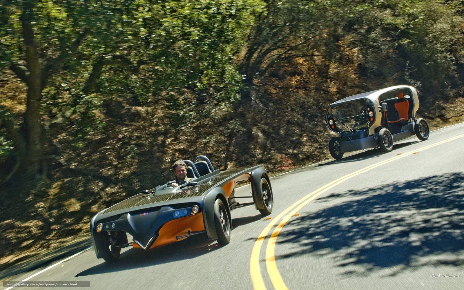 Two cars on a winding road