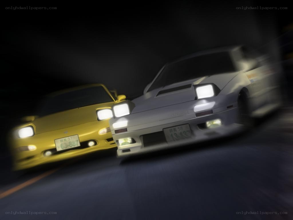 Two cars racing at night