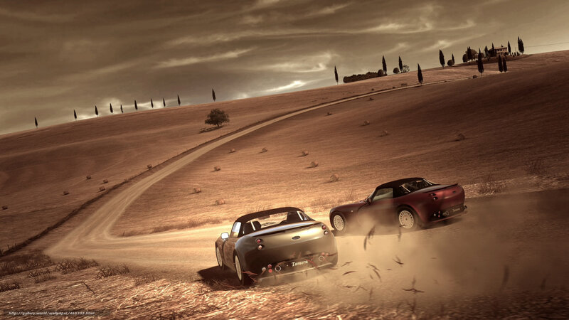 Two cars racing on a dirt road