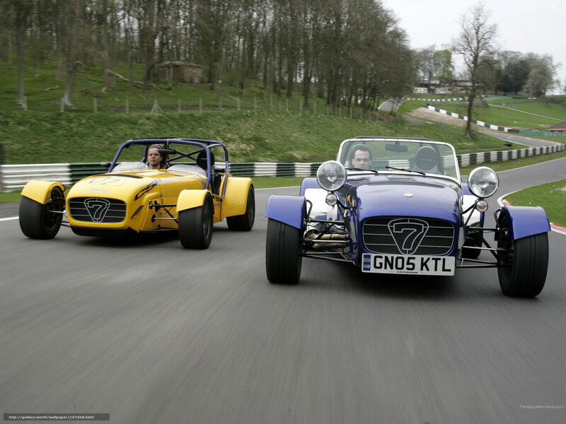 Two Caterham 7 race cars on track