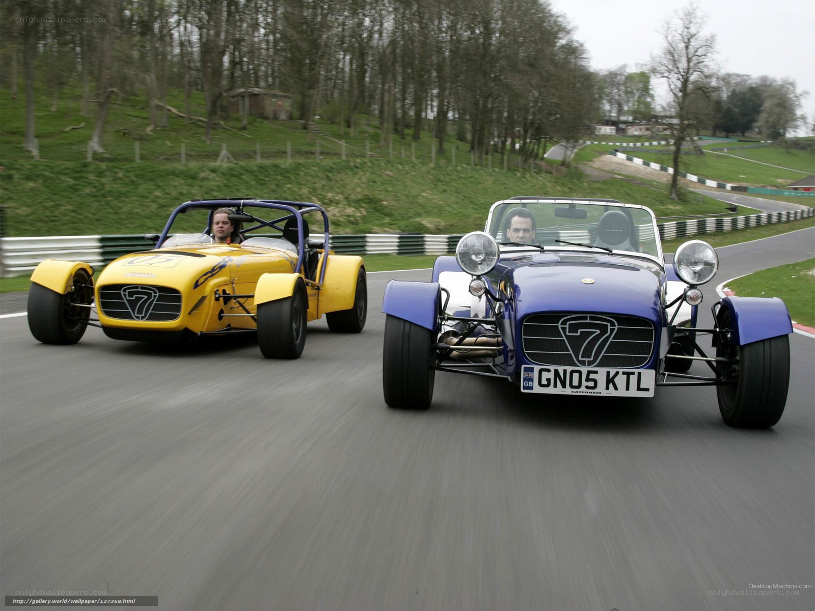 Two Caterham 7 race cars on track