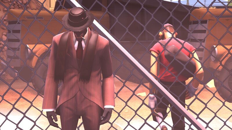 Two characters behind a fence