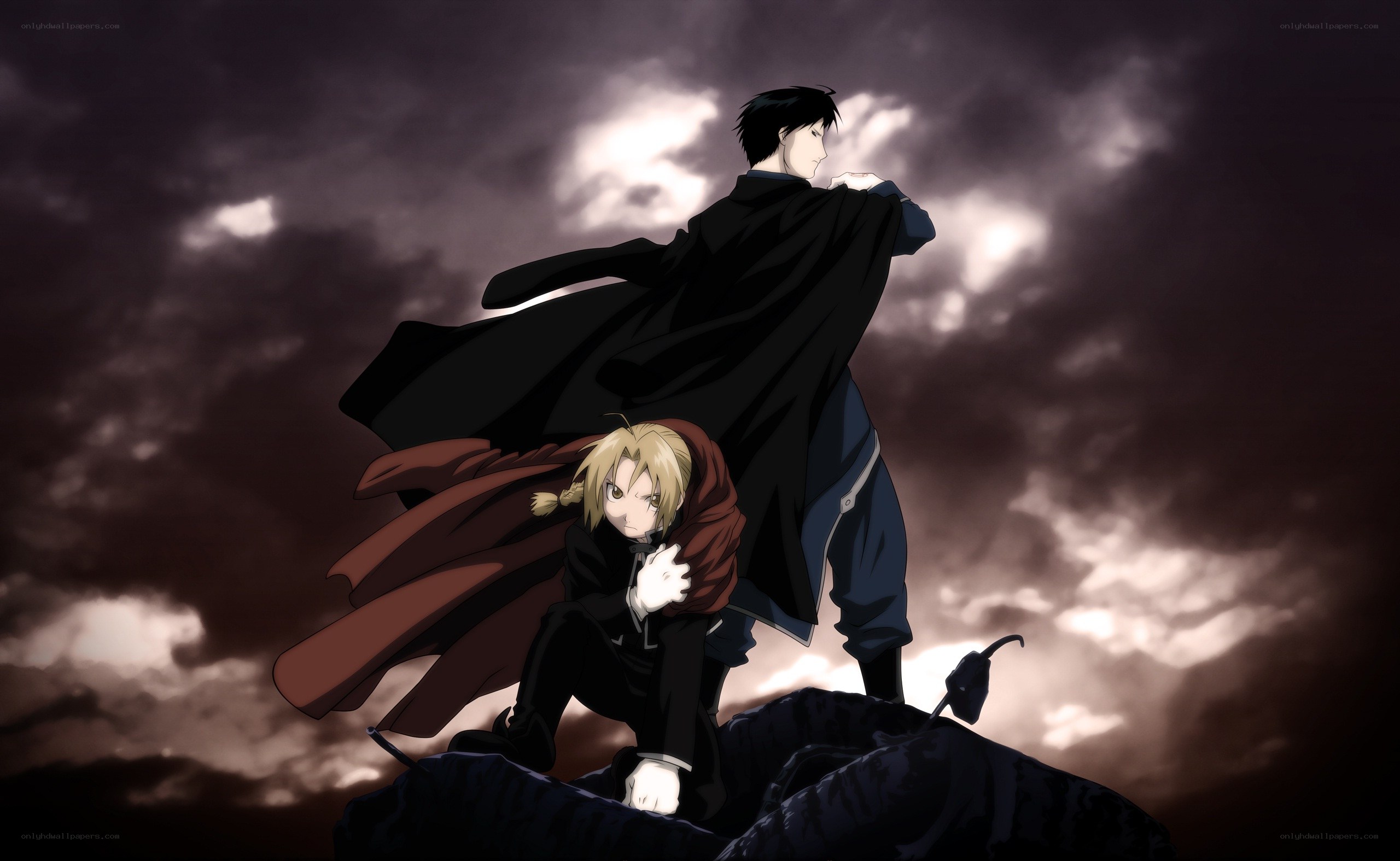 Two characters on a rocky peak