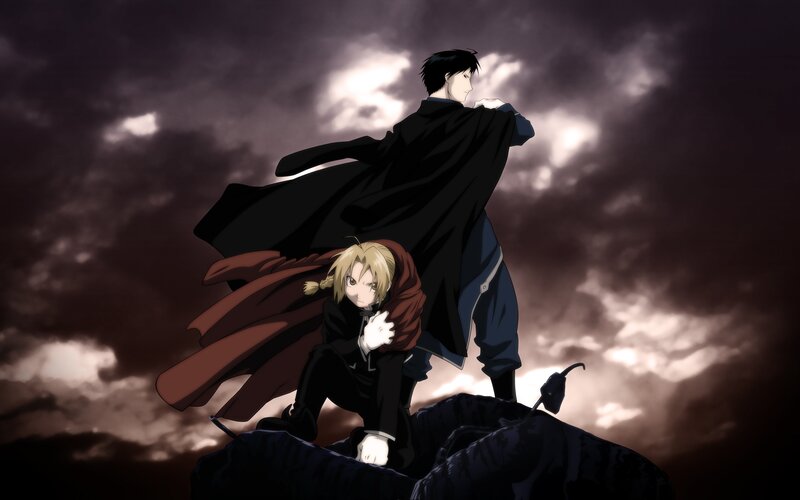 Two characters on a rocky peak