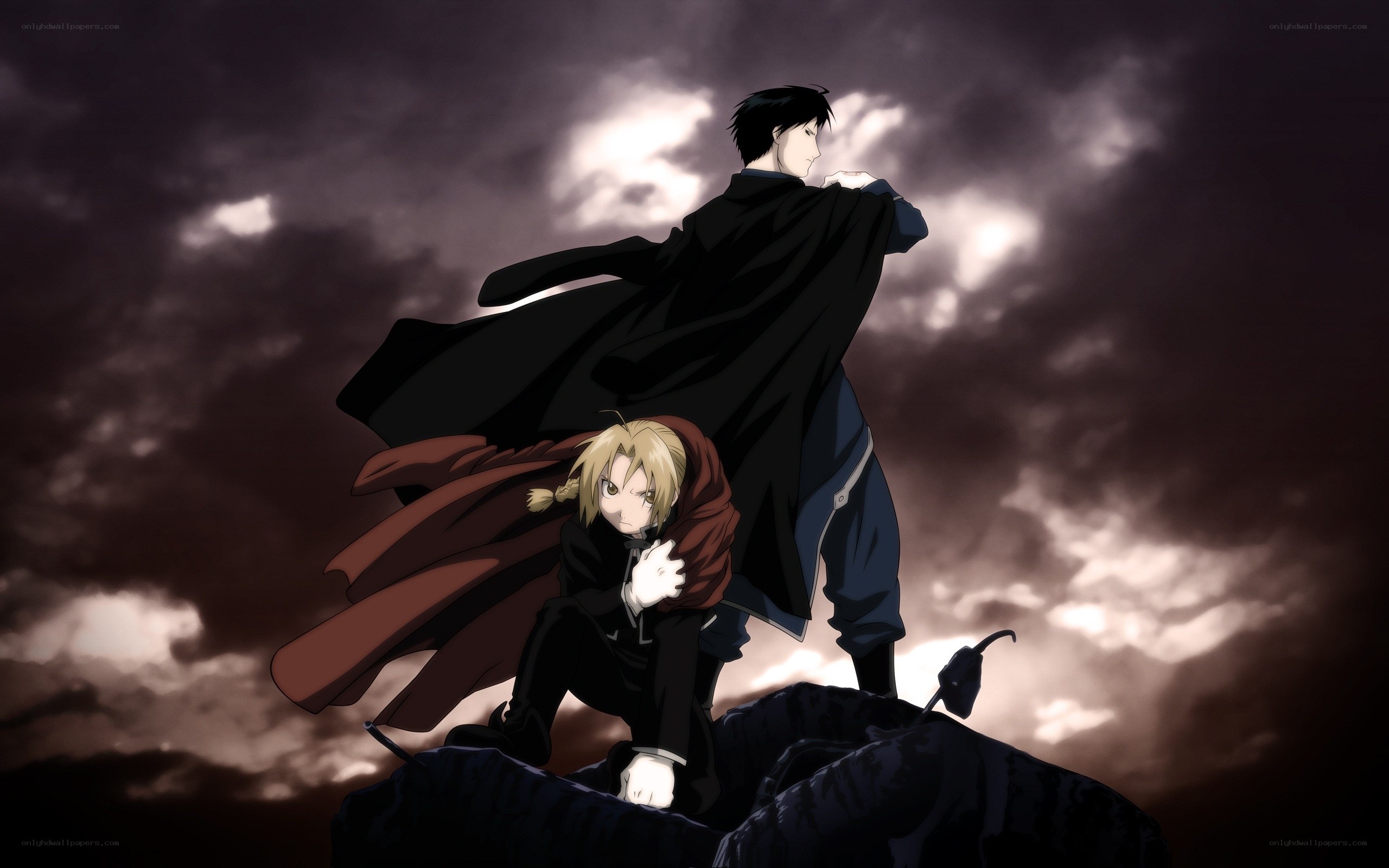 Two characters on a rocky peak