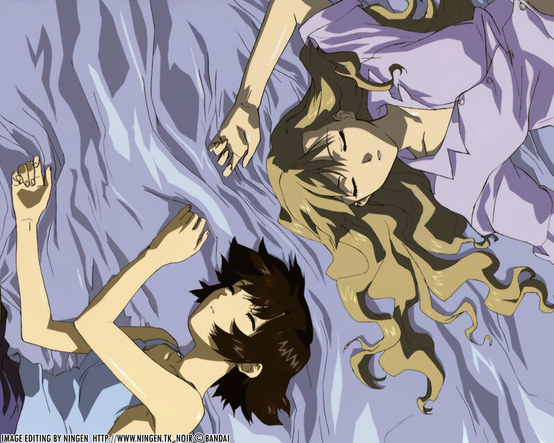 Two characters sleeping on a bed