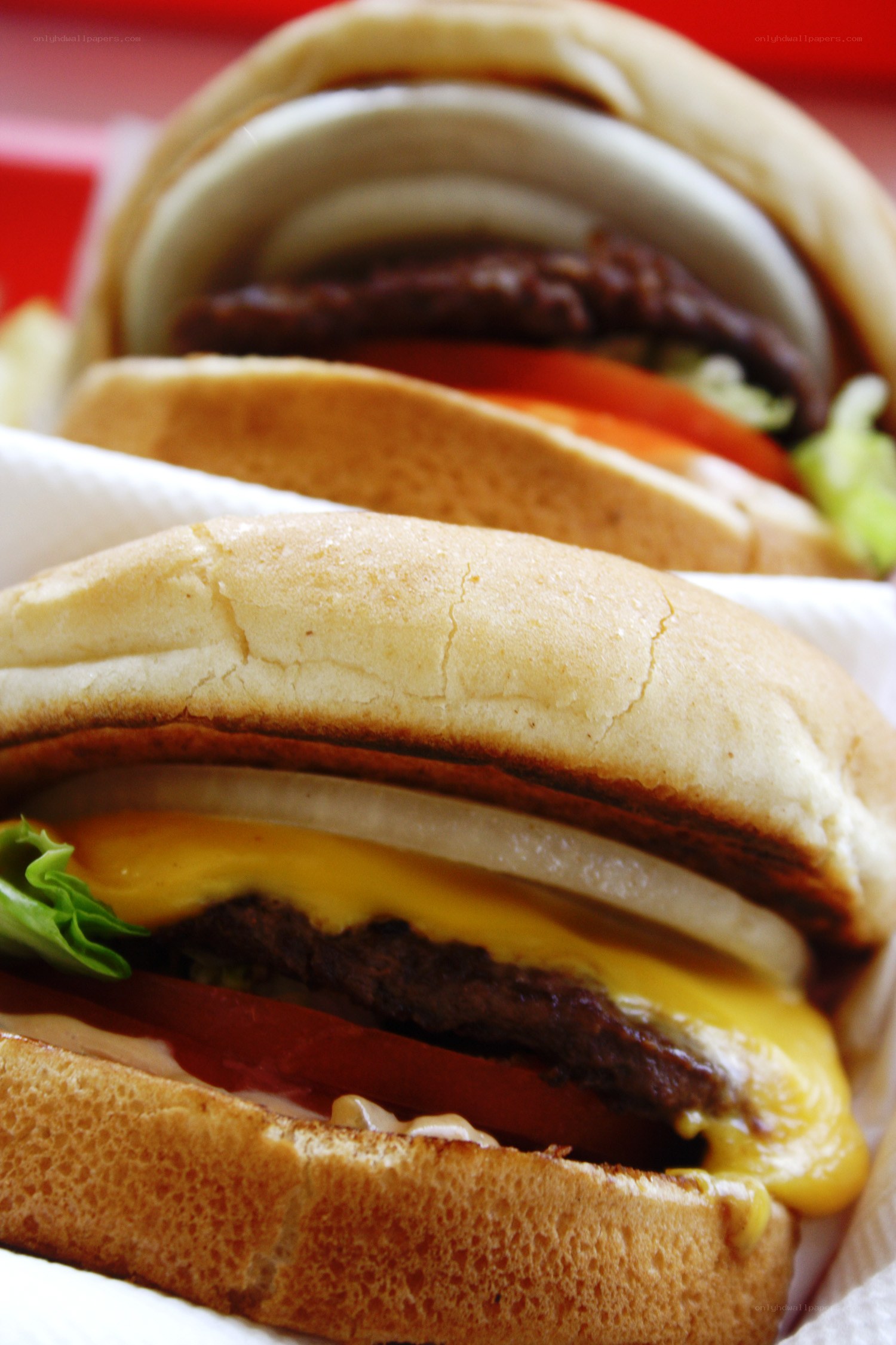 Two cheeseburgers in a tray