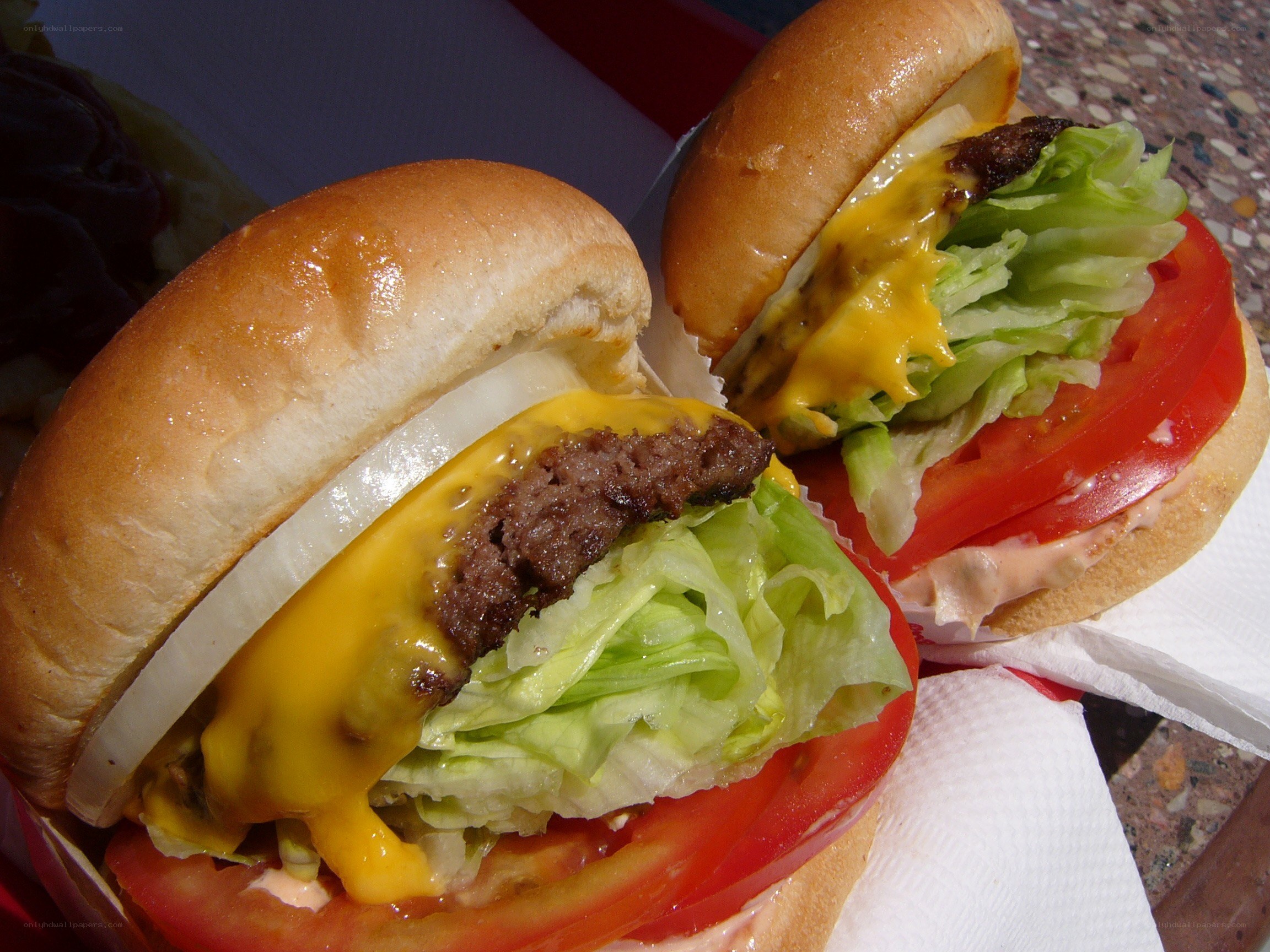 Two cheeseburgers on a tray