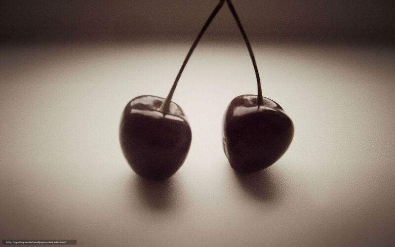 two cherries on a surface