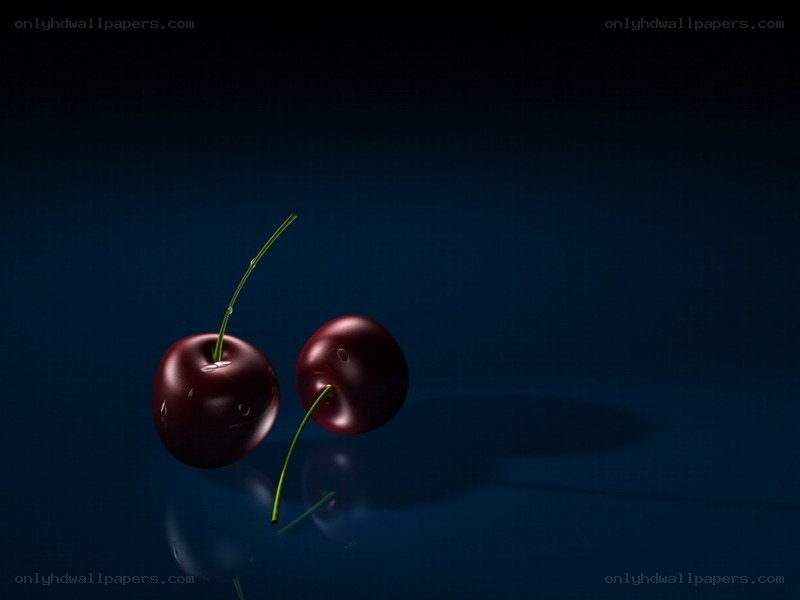 Two cherries on dark blue