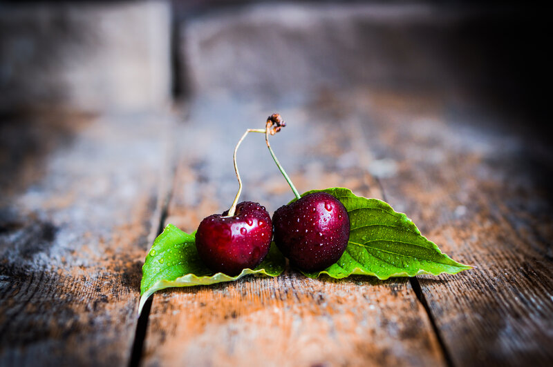 Two Cherries on Leaf