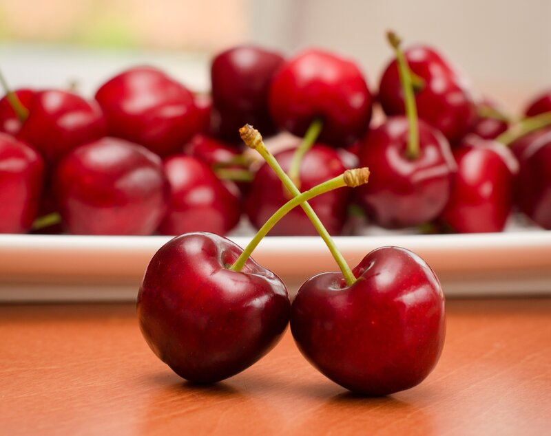 Two Cherries on Table