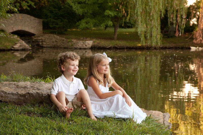 Two Children by Pond