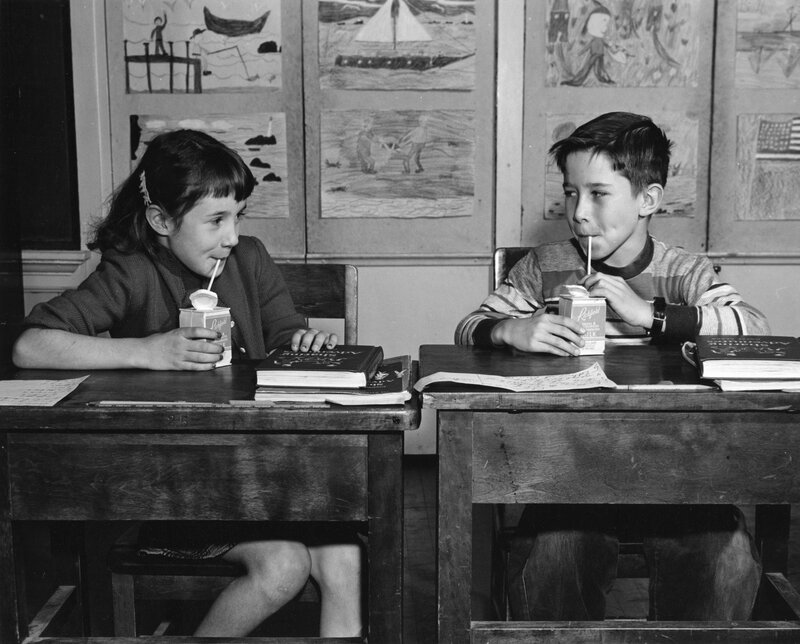 Two Children Drinking Milk