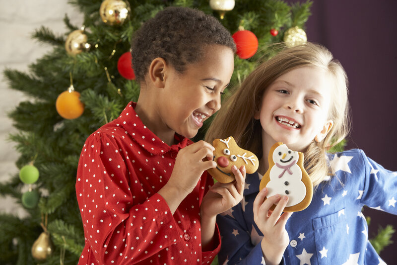 Two Children Holding Cookies