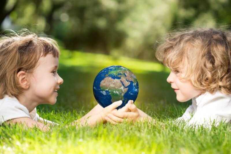 Two Children Holding Globe