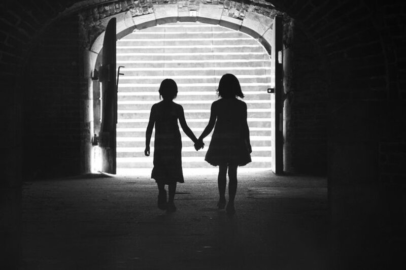 Two Children Holding Hands — Black, Dramatic