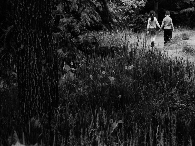 Two Children Holding Hands — Black