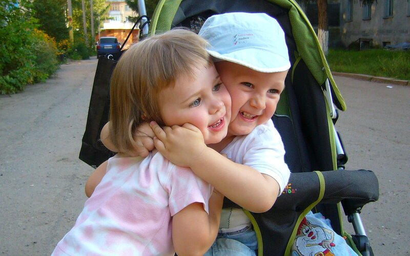 Two Children Hugging — Green