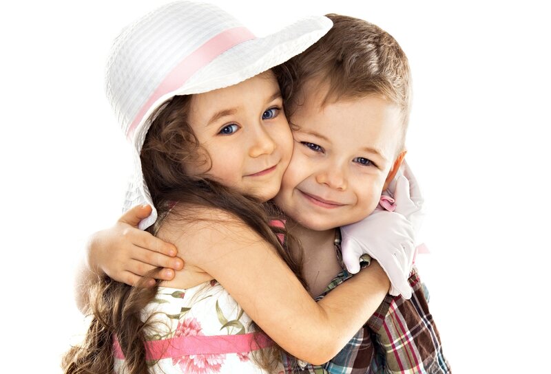 Two Children Hugging — White