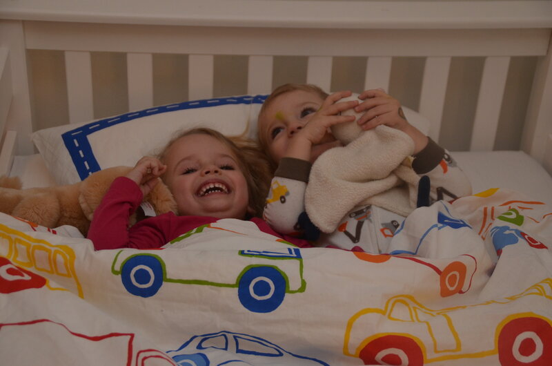 Two Children in Bed — White