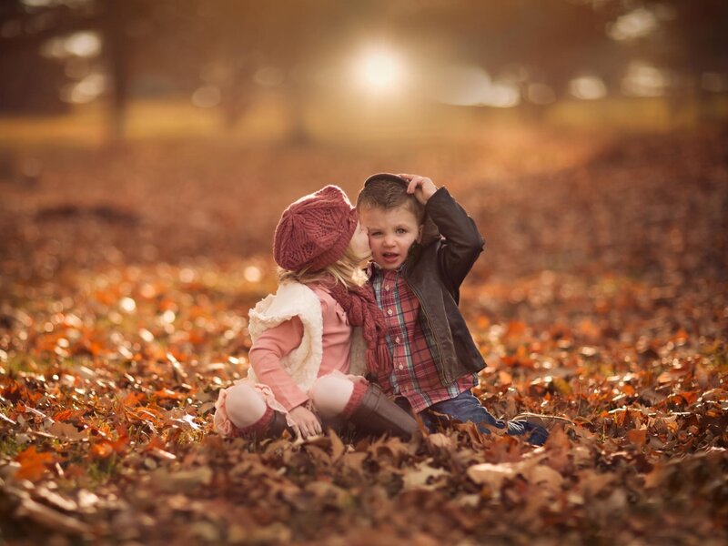 Two Children in Leaves — Brown, Warm, Autumn