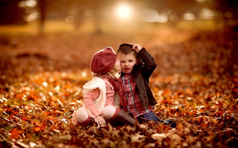 Two Children in Leaves — Orange, Warm, Autumn