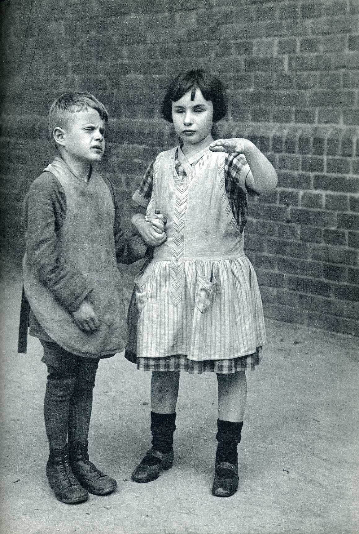 Two children in vintage clothing