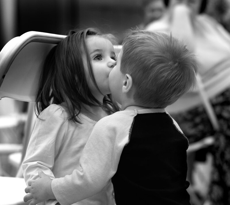 Two Children Kissing — Black, Intimate