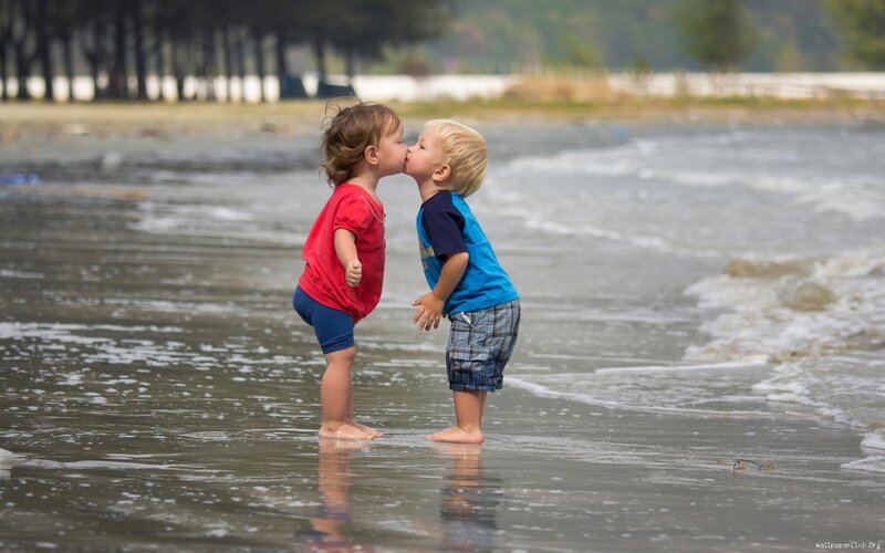 Two Children Kissing — Blue, Playful, Afternoon