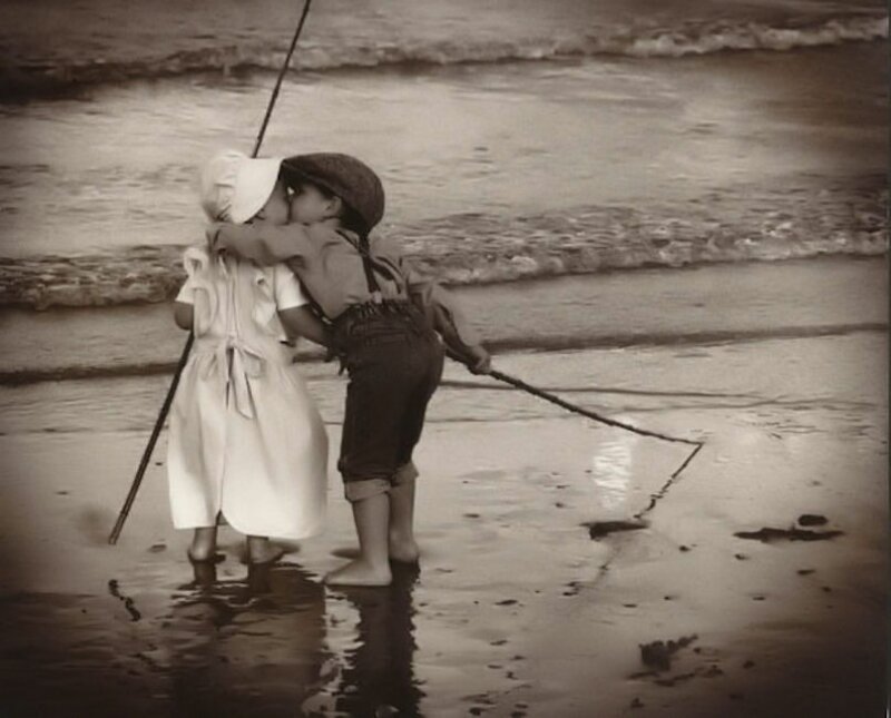 Two Children Kissing on Beach
