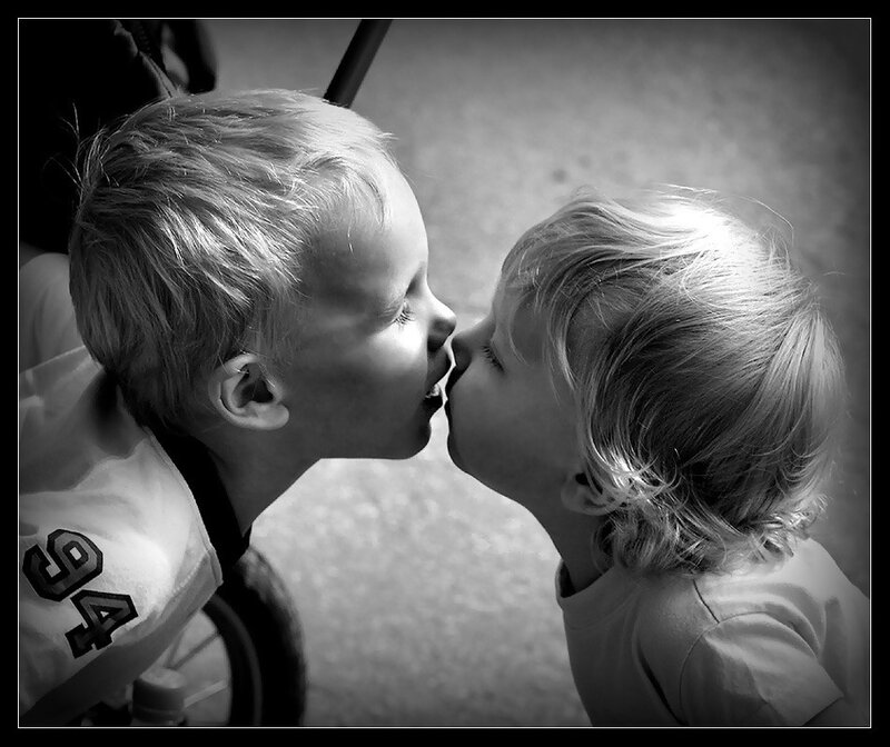 two children kissing