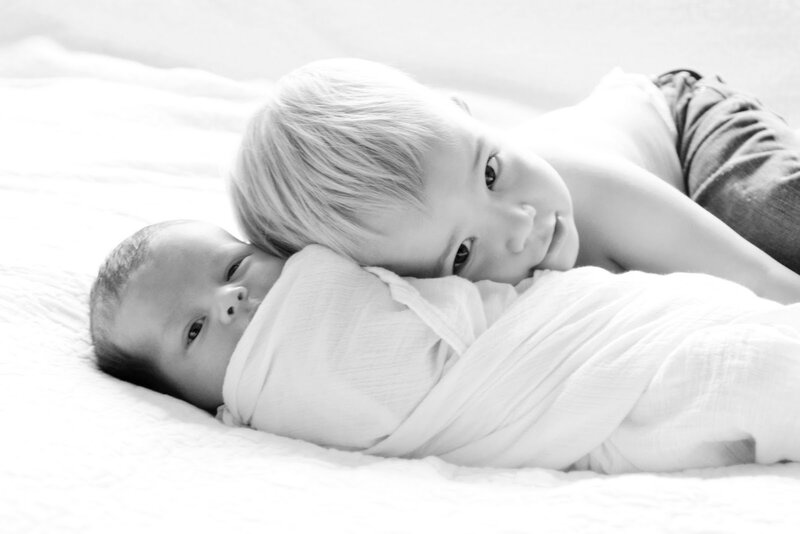 Two Children Lying Down — Black