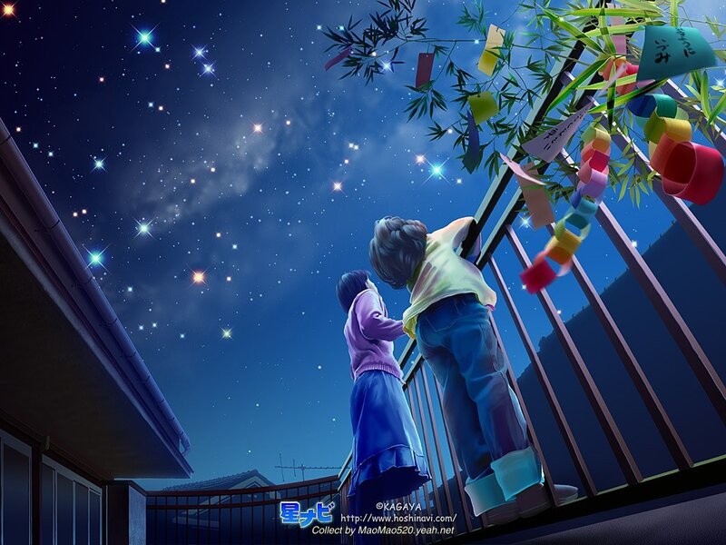 Two children on a balcony at night