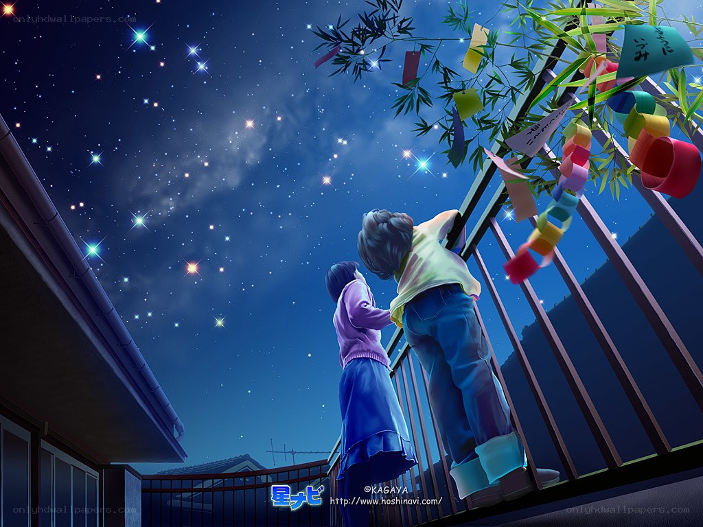 Two children on a balcony at night
